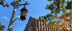 Picture of light post and building on campus