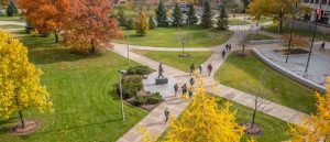 campus in fall with students walking